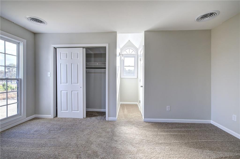 2193 West Ellis Road Griffin, GA 30223 - Photo 15 of 26 an empty room with windows