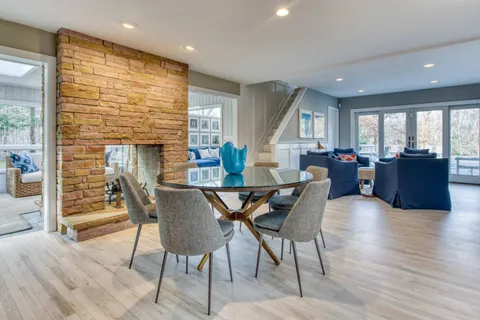 a view of a dining room with furniture window and wooden floor