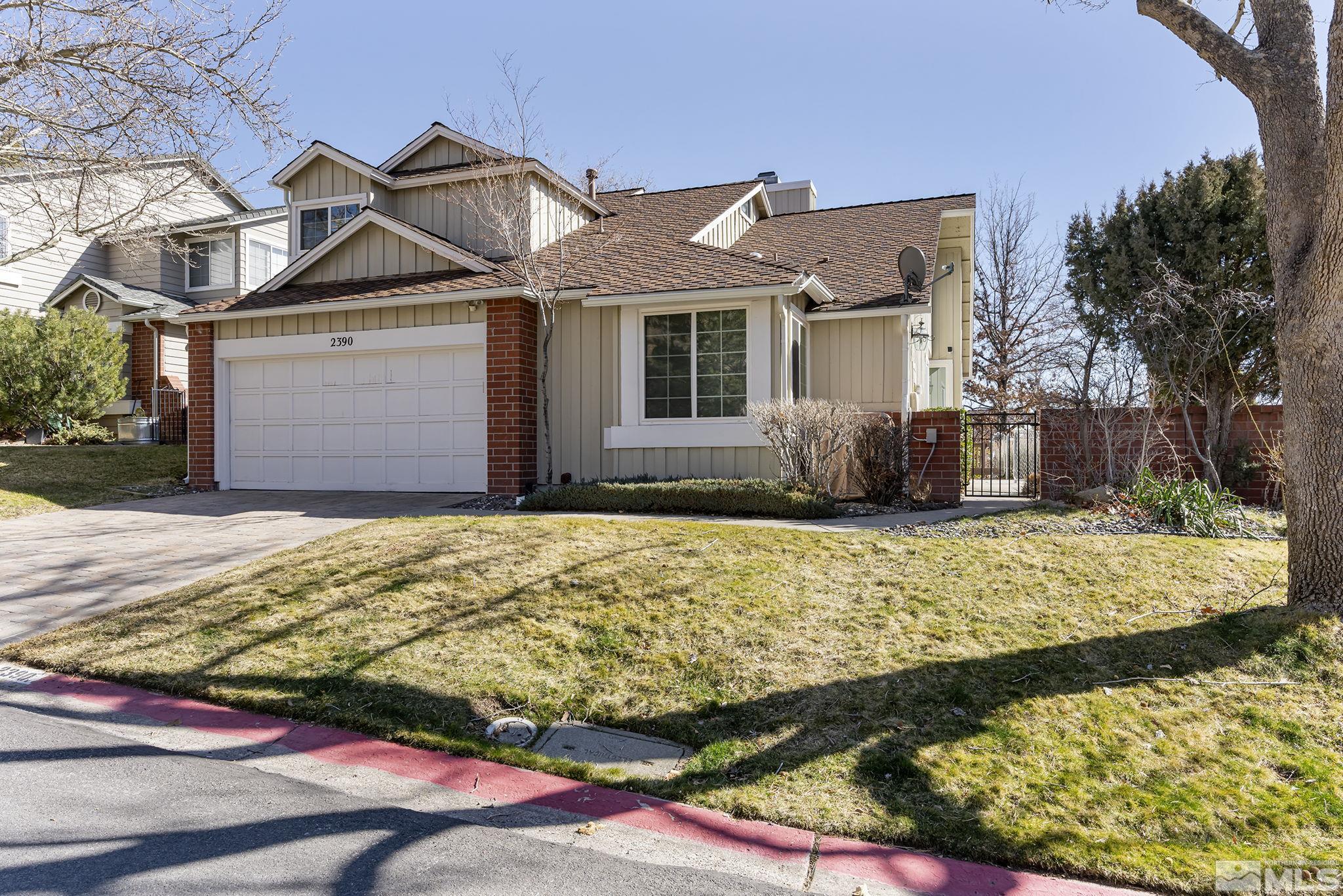 2390 High Terrace Drive Reno, NV 89509 - Photo 1 of 36 a front view of a house with a yard