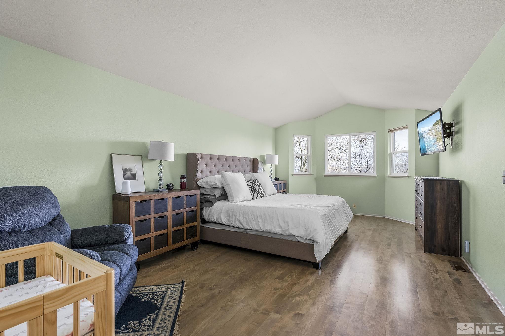 2390 High Terrace Drive Reno, NV 89509 - Photo 13 of 36 a bedroom with a bed and a couch