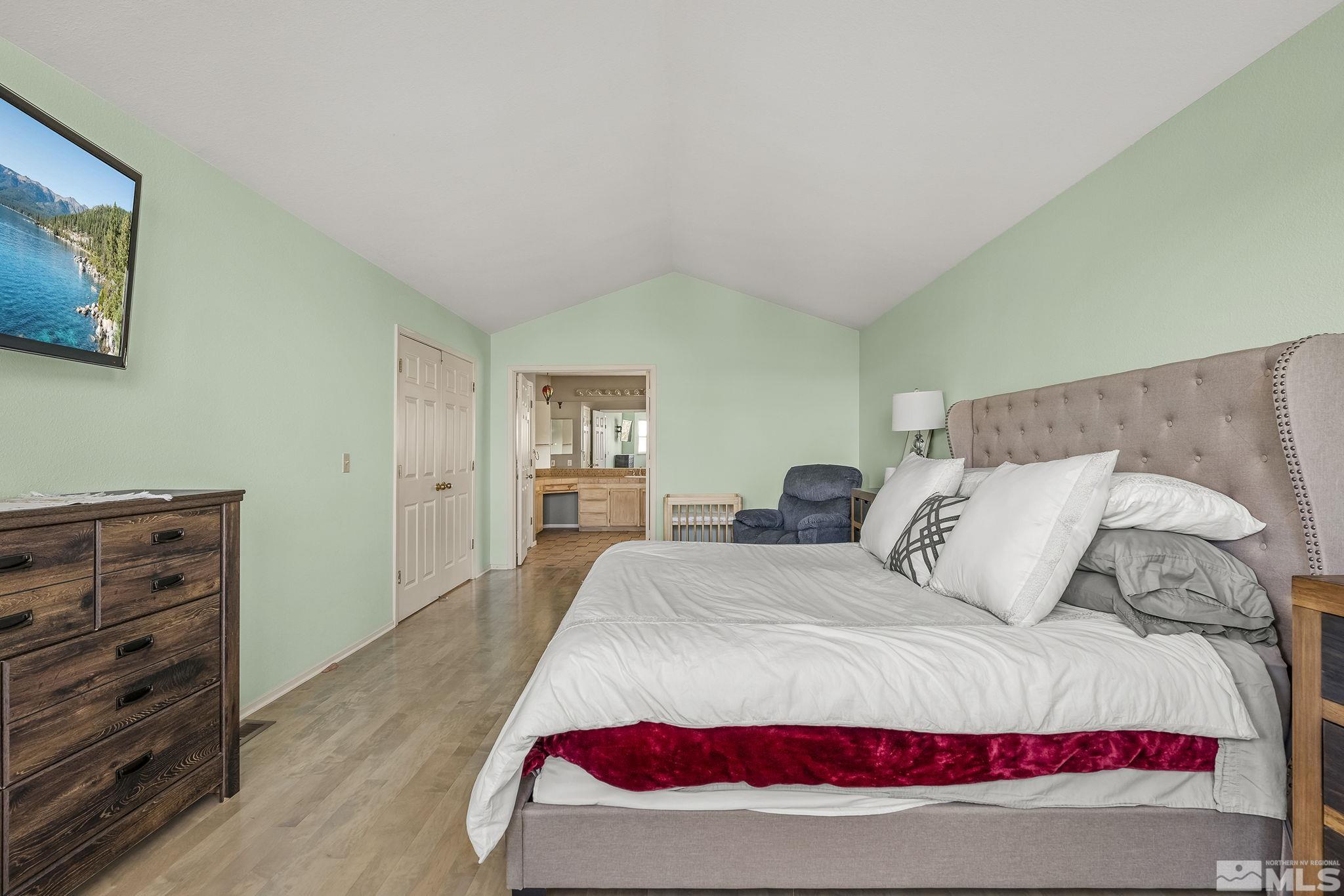 2390 High Terrace Drive Reno, NV 89509 - Photo 14 of 36 a bedroom with a bed and cabinet