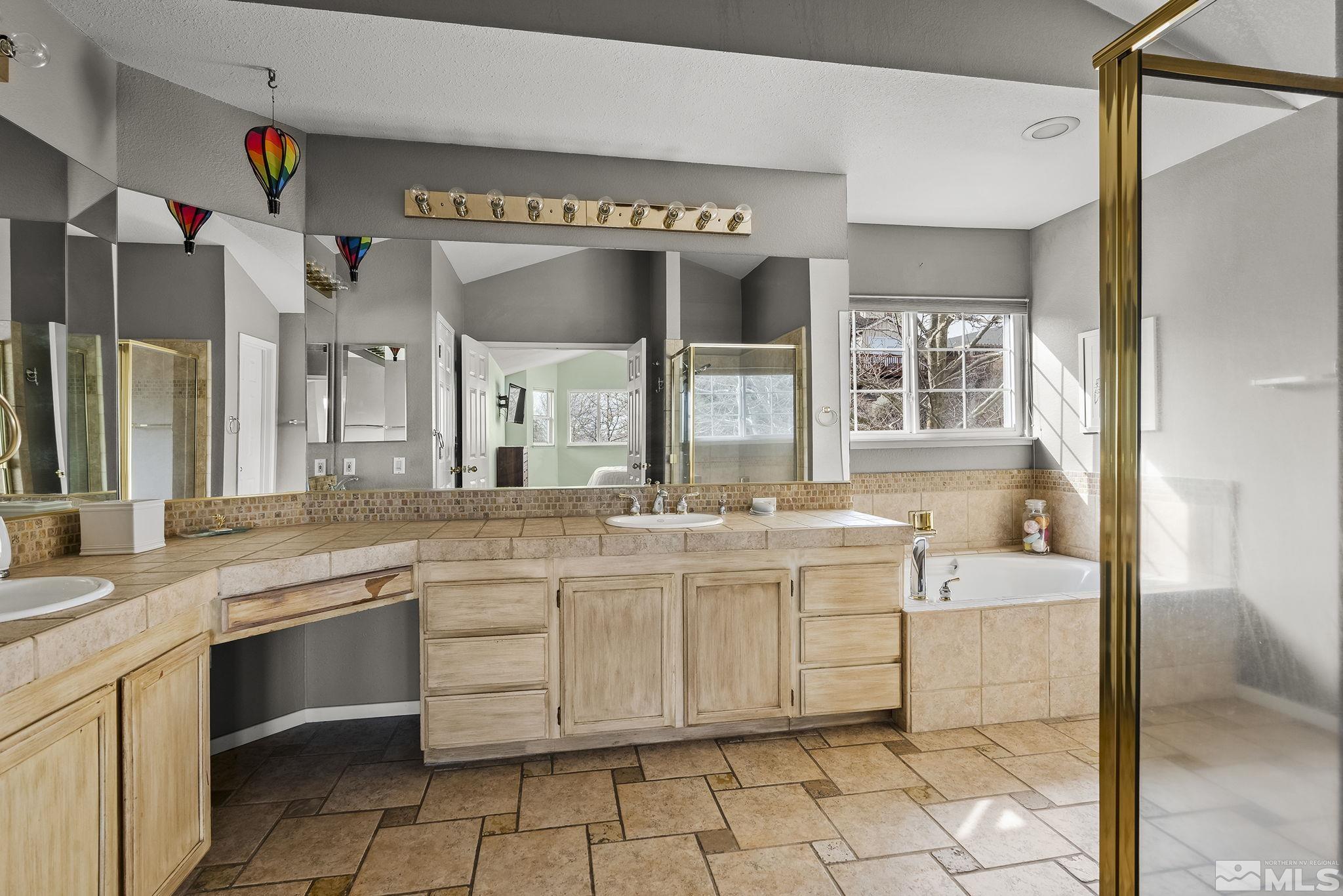 2390 High Terrace Drive Reno, NV 89509 - Photo 15 of 36 a large white kitchen with a sink and cabinets