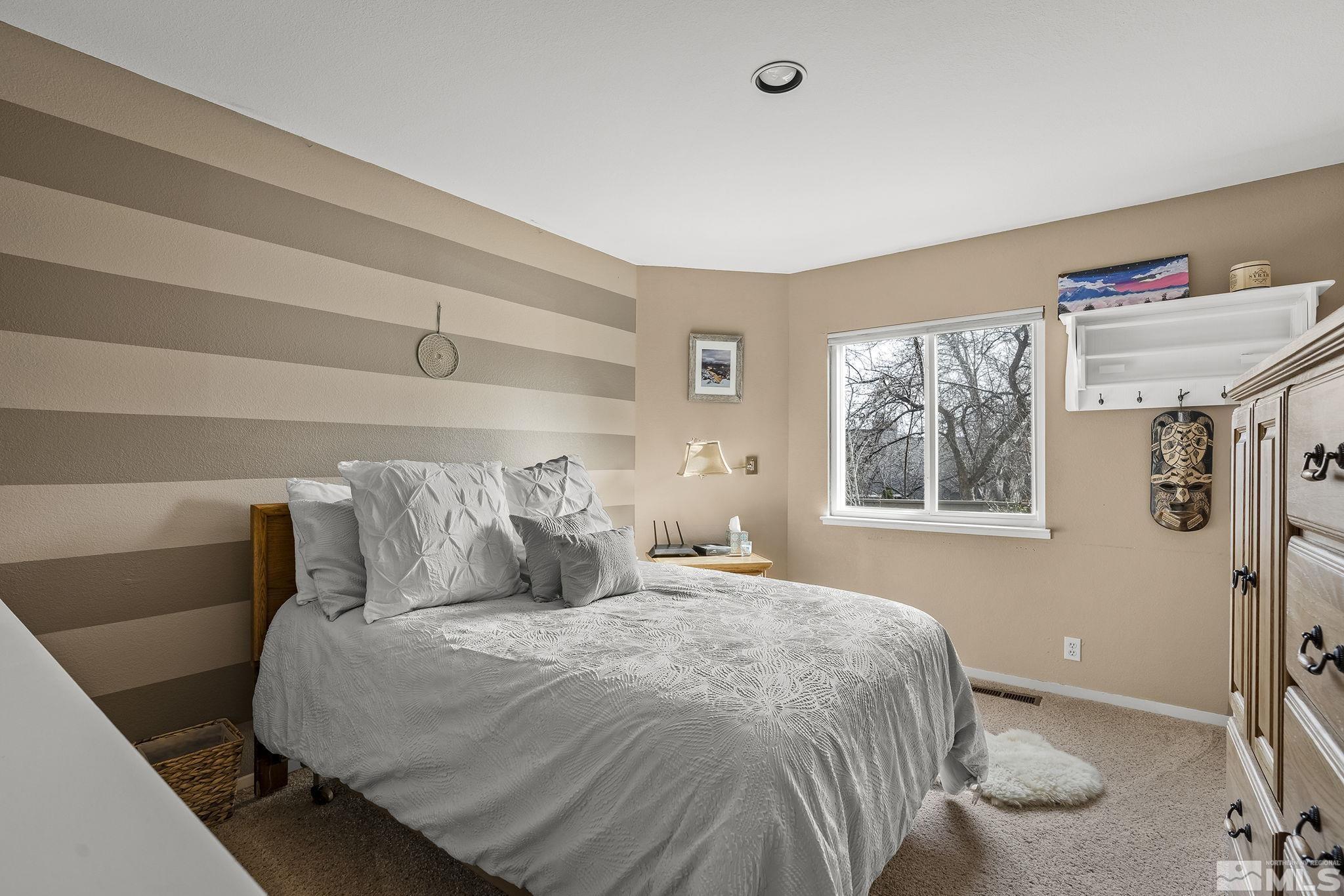 2390 High Terrace Drive Reno, NV 89509 - Photo 16 of 36 a bedroom with a bed and window