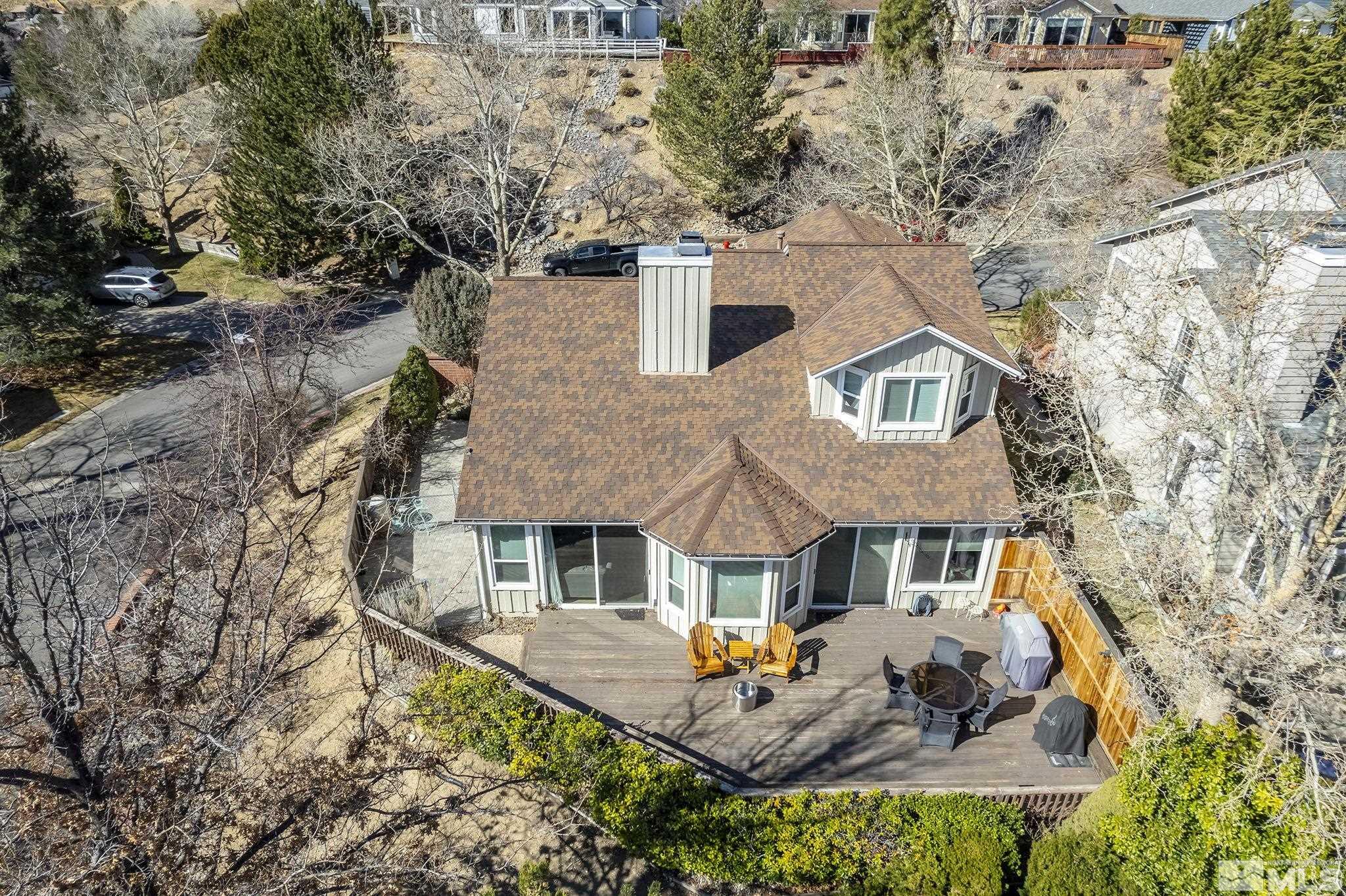2390 High Terrace Drive Reno, NV 89509 - Photo 24 of 36 a front view of house with yard and trees around