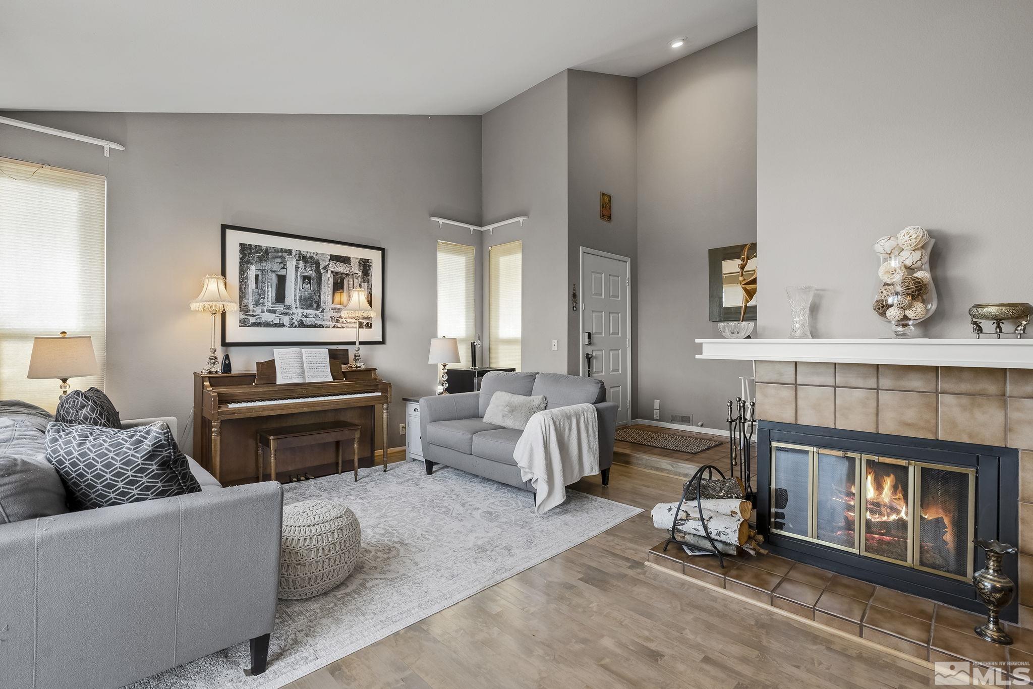 2390 High Terrace Drive Reno, NV 89509 - Photo 3 of 36 a living room with furniture and a fireplace