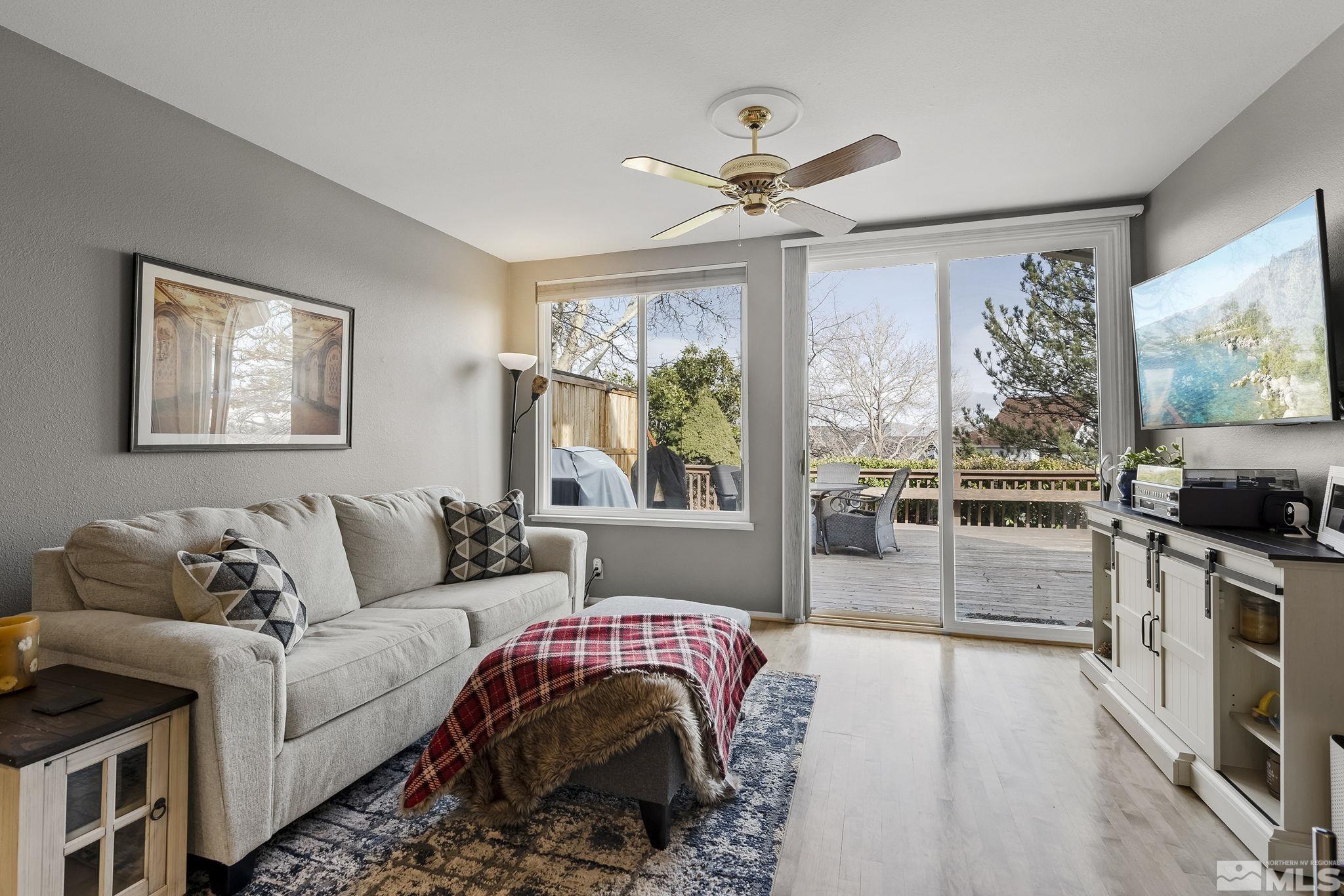2390 High Terrace Drive Reno, NV 89509 - Photo 9 of 36 a living room with furniture and a flat screen tv