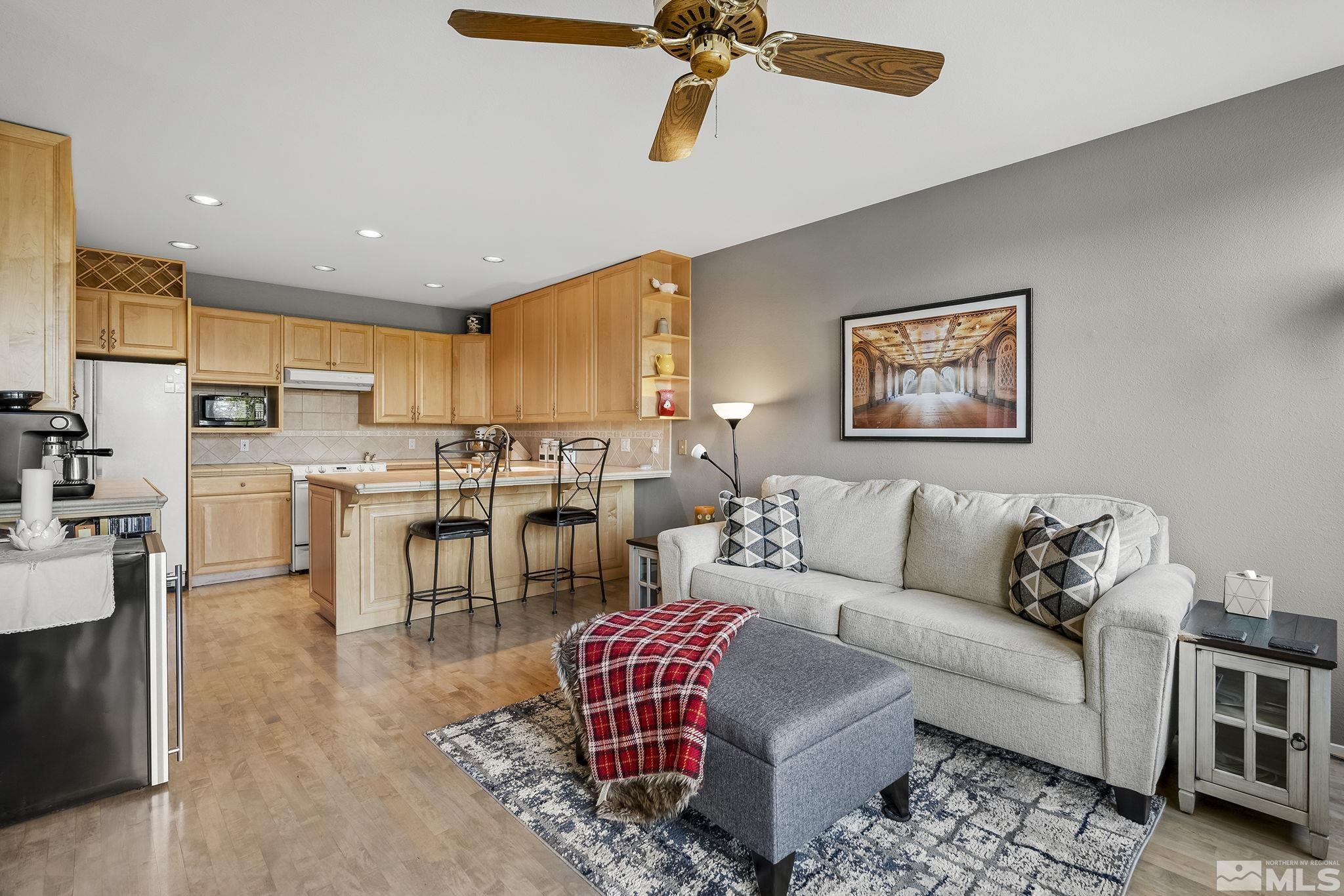 2390 High Terrace Drive Reno, NV 89509 - Photo 10 of 36 a living room with furniture kitchen view and a wooden floor