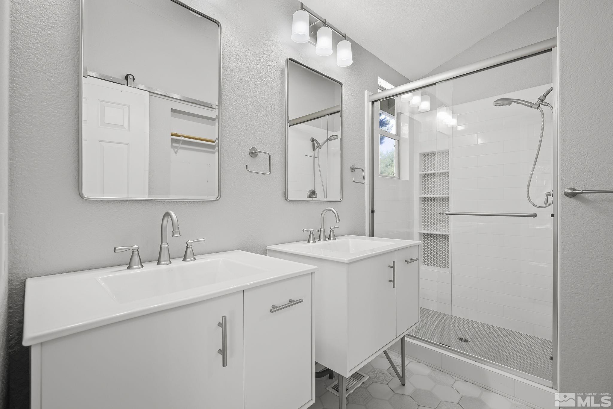 4755 Scenic Hill Circle Reno, NV 89523 - Photo 14 of 20 a bathroom with a sink and a mirror
