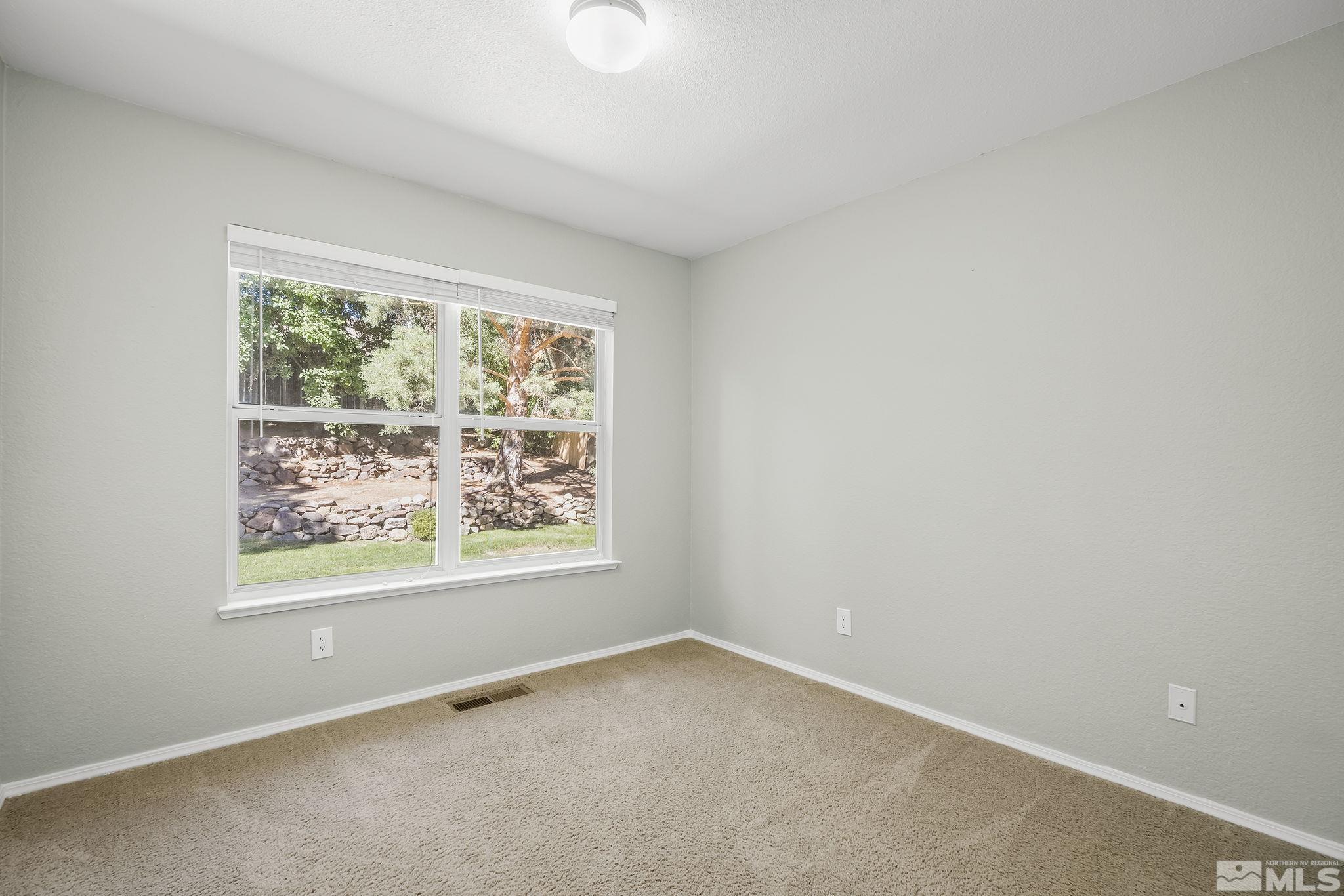 4755 Scenic Hill Circle Reno, NV 89523 - Photo 15 of 20 an empty room with a window