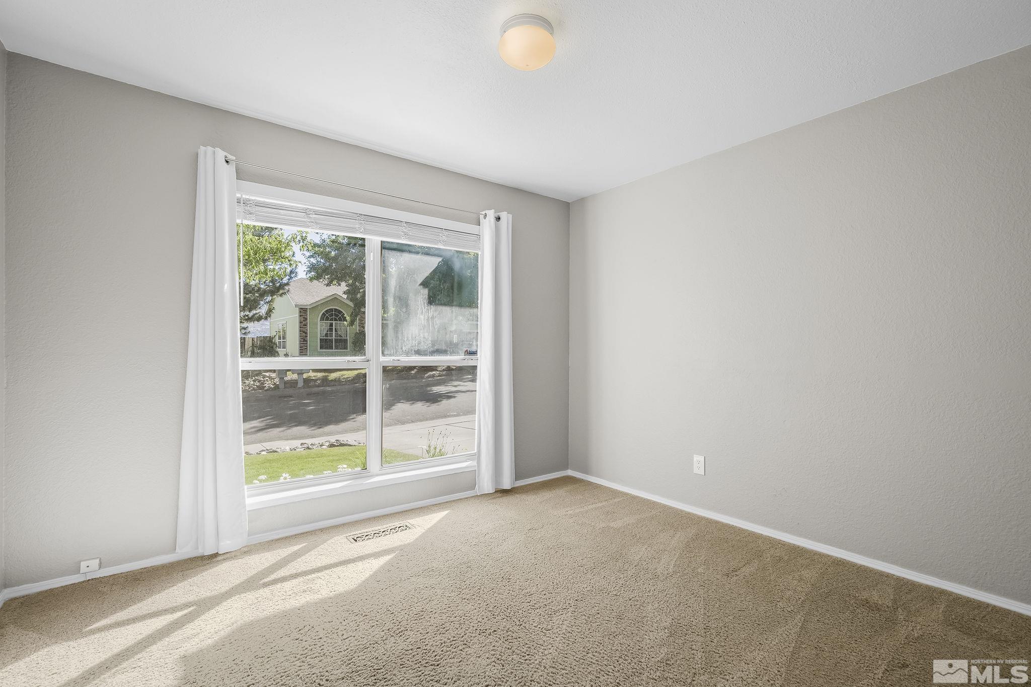 4755 Scenic Hill Circle Reno, NV 89523 - Photo 16 of 20 a view of a room with a large window