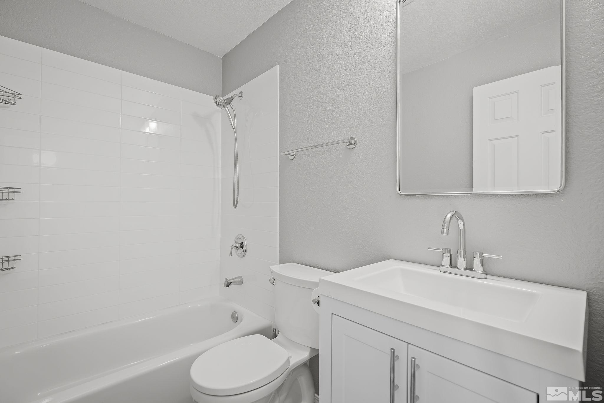 4755 Scenic Hill Circle Reno, NV 89523 - Photo 17 of 20 a bathroom with a sink toilet and shower