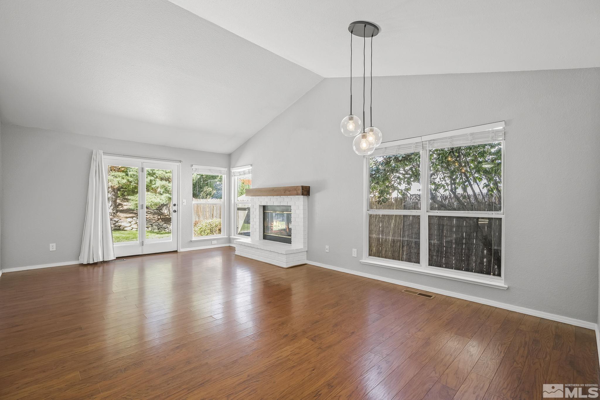 4755 Scenic Hill Circle Reno, NV 89523 - Photo 3 of 20 a view of empty room with wooden floor and fan