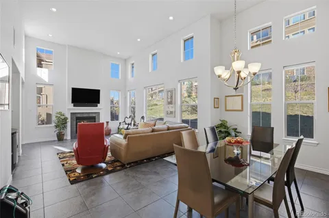 a living room with fireplace furniture and a flat screen tv