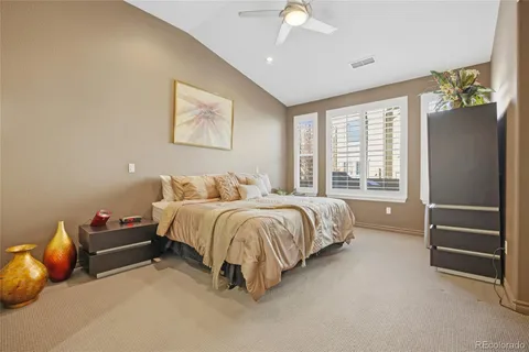 a spacious bedroom with a bed and a window