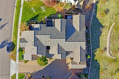 an aerial view of a house with swimming pool