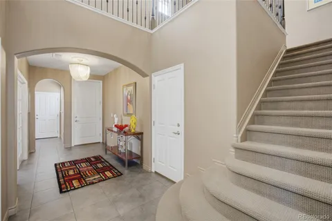 a view of front door with staircase