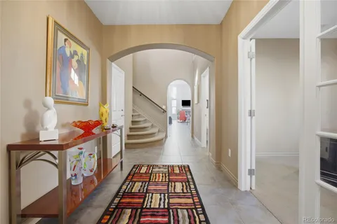 a view of an entryway with wooden floor