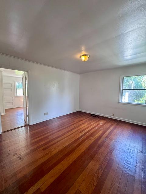240 Pleasant Street Colfax, CA 95713 - Photo 12 of 26 an empty room with wooden floor and windows