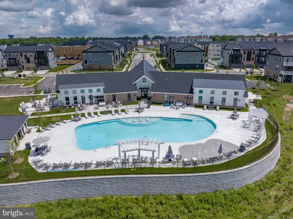 a swimming pool with outdoor seating and yard