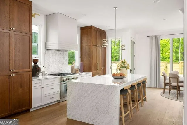 a dining room with furniture a chandelier and window