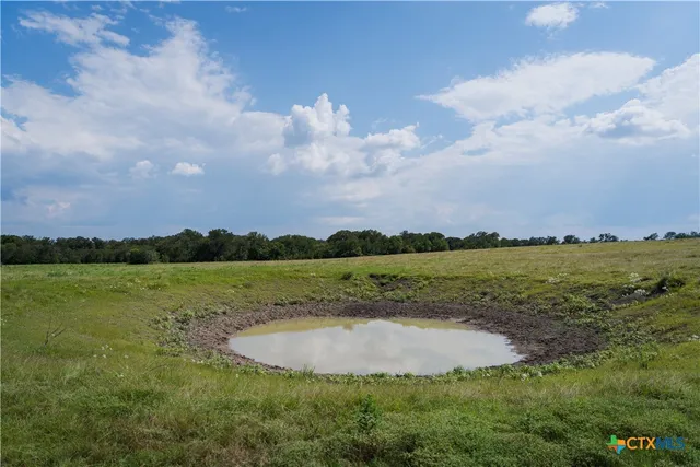 a view of a lake and city in the background