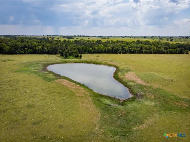 a view of a pool in front of the building