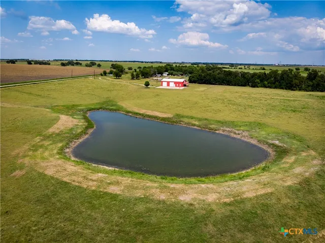 a view of a bench near a lake