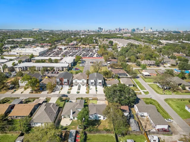 an aerial view of a city with lots of residential buildings