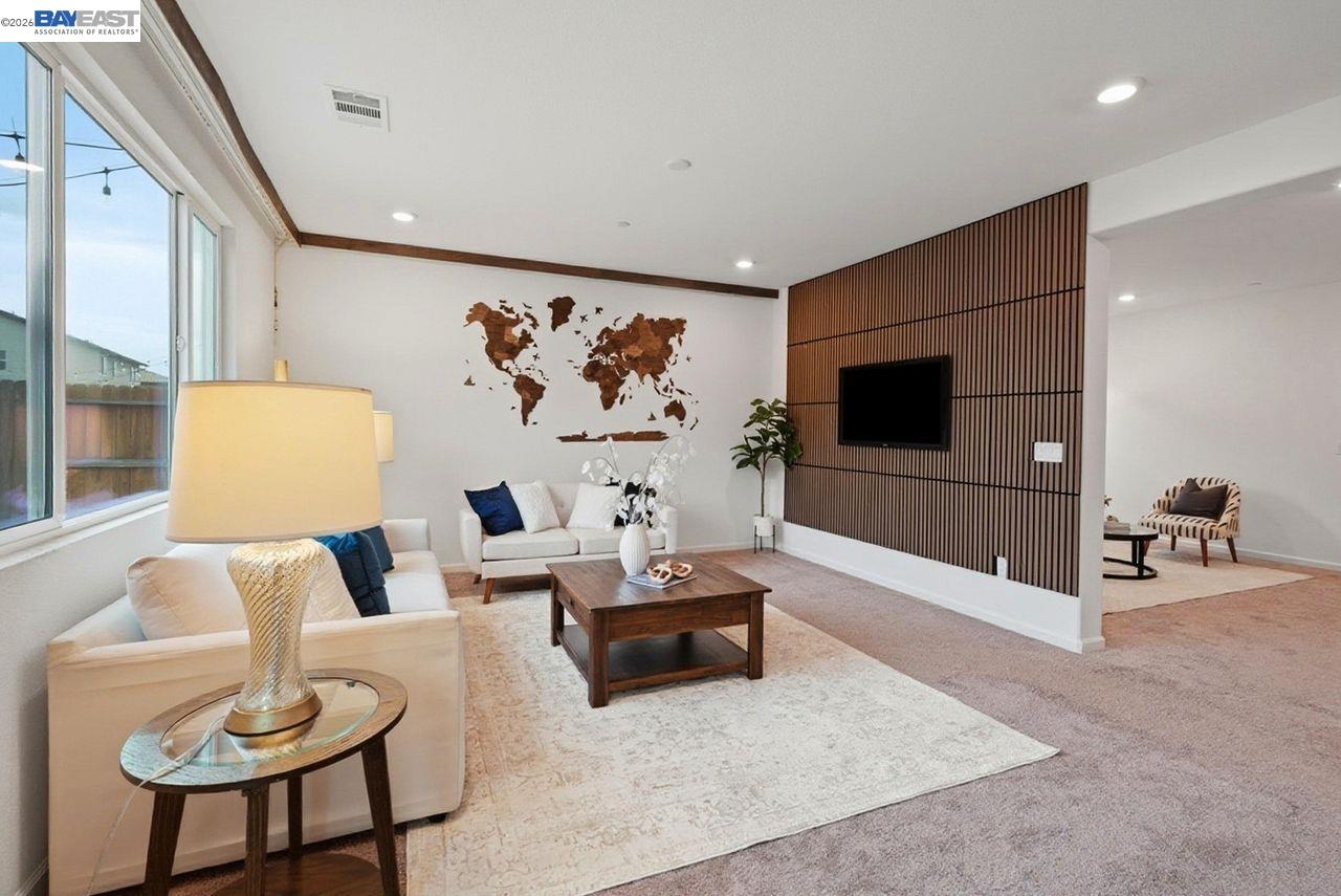 1444 Meridian Street Manteca, CA 95337 - Photo 11 of 45 a living room with furniture and a flat screen tv