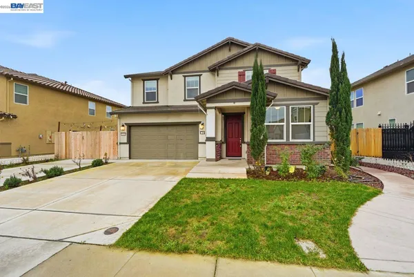 a front view of a house with yard