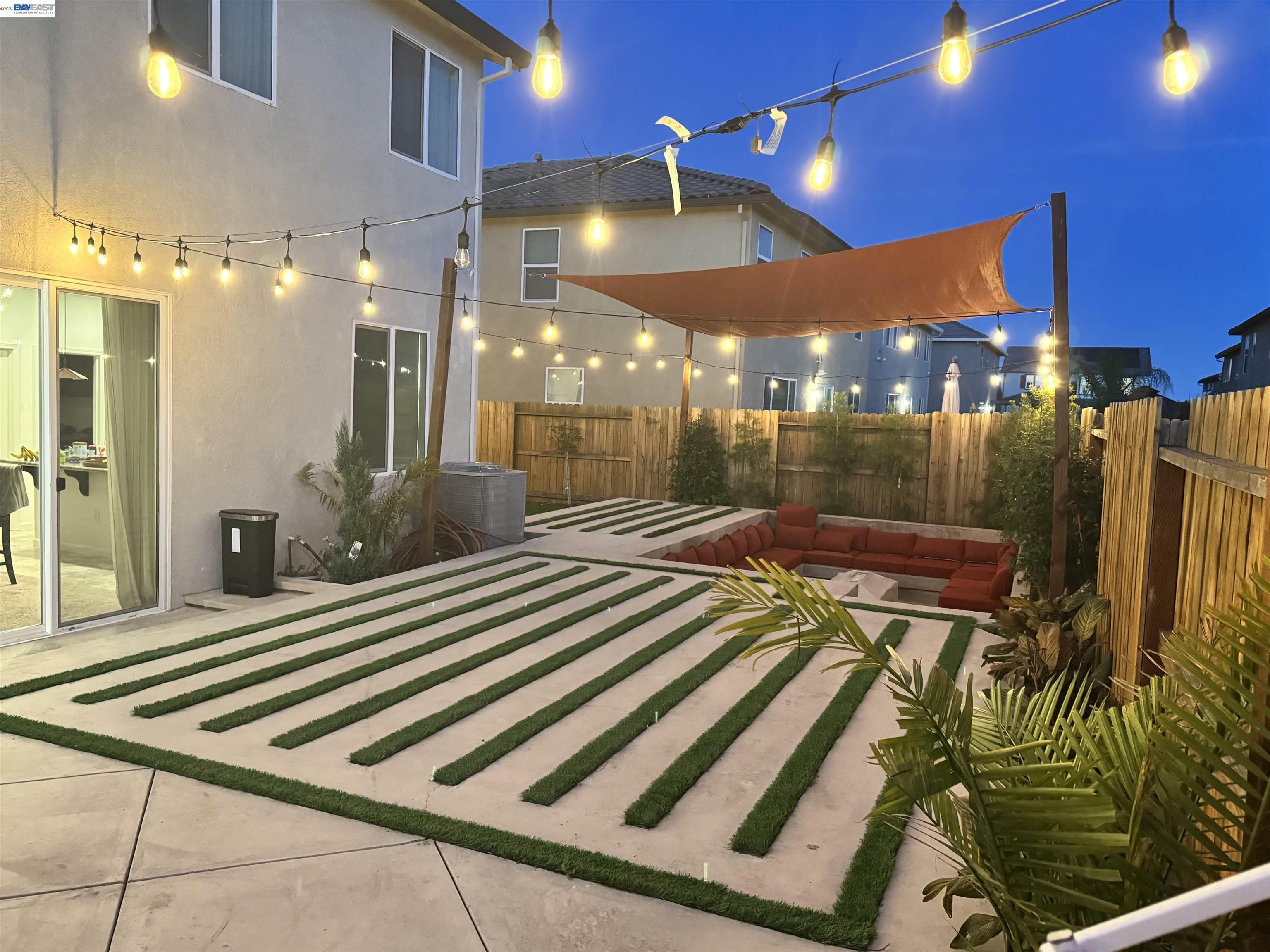 1444 Meridian Street Manteca, CA 95337 - Photo 2 of 45 a view of a patio with a table and chairs