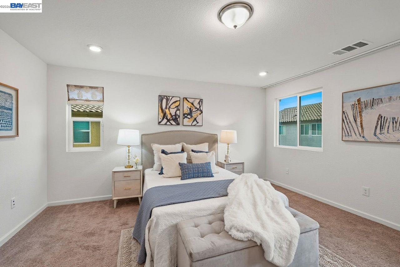 1444 Meridian Street Manteca, CA 95337 - Photo 23 of 45 a bedroom with a bed and a window