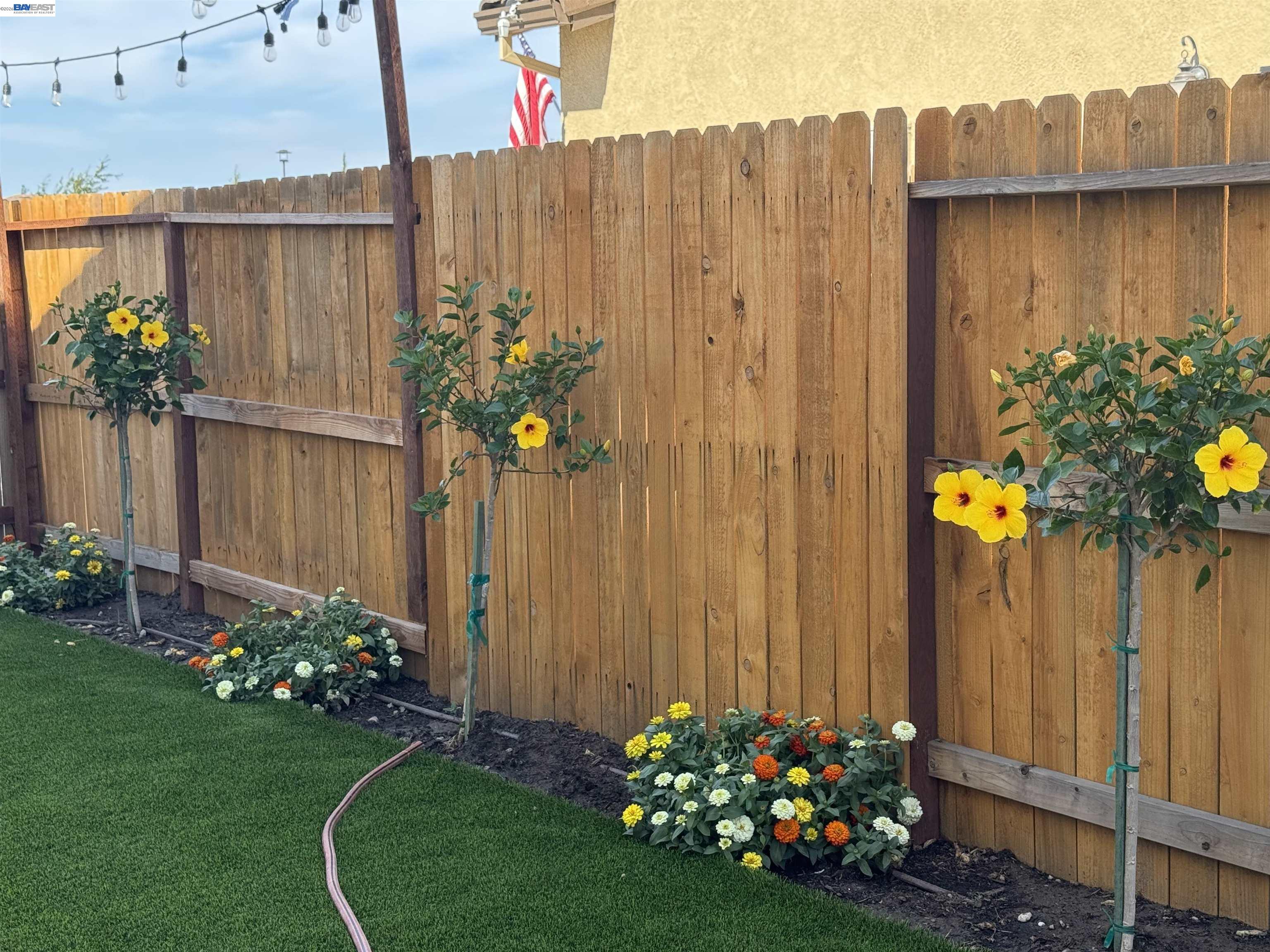 1444 Meridian Street Manteca, CA 95337 - Photo 38 of 45 a view of a wooden fence and a bench in a yard