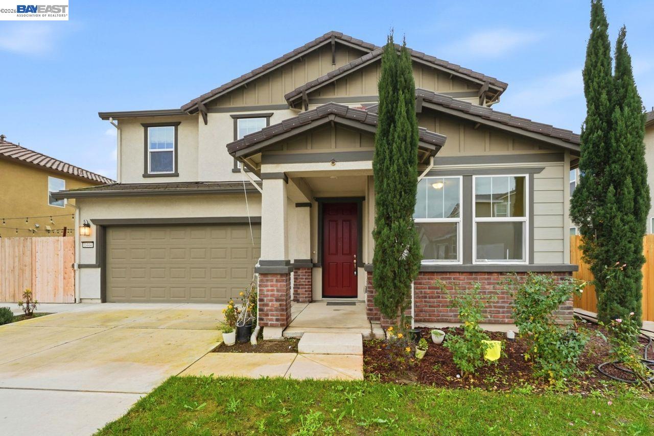 1444 Meridian Street Manteca, CA 95337 - Photo 5 of 45 a view of a house with yard and garage