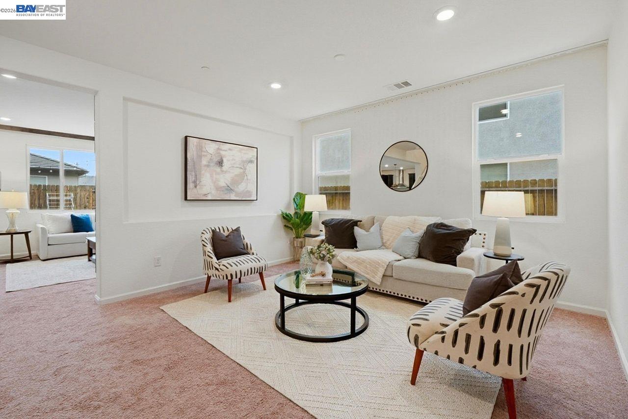 1444 Meridian Street Manteca, CA 95337 - Photo 8 of 45 a living room with furniture a rug and wooden floor
