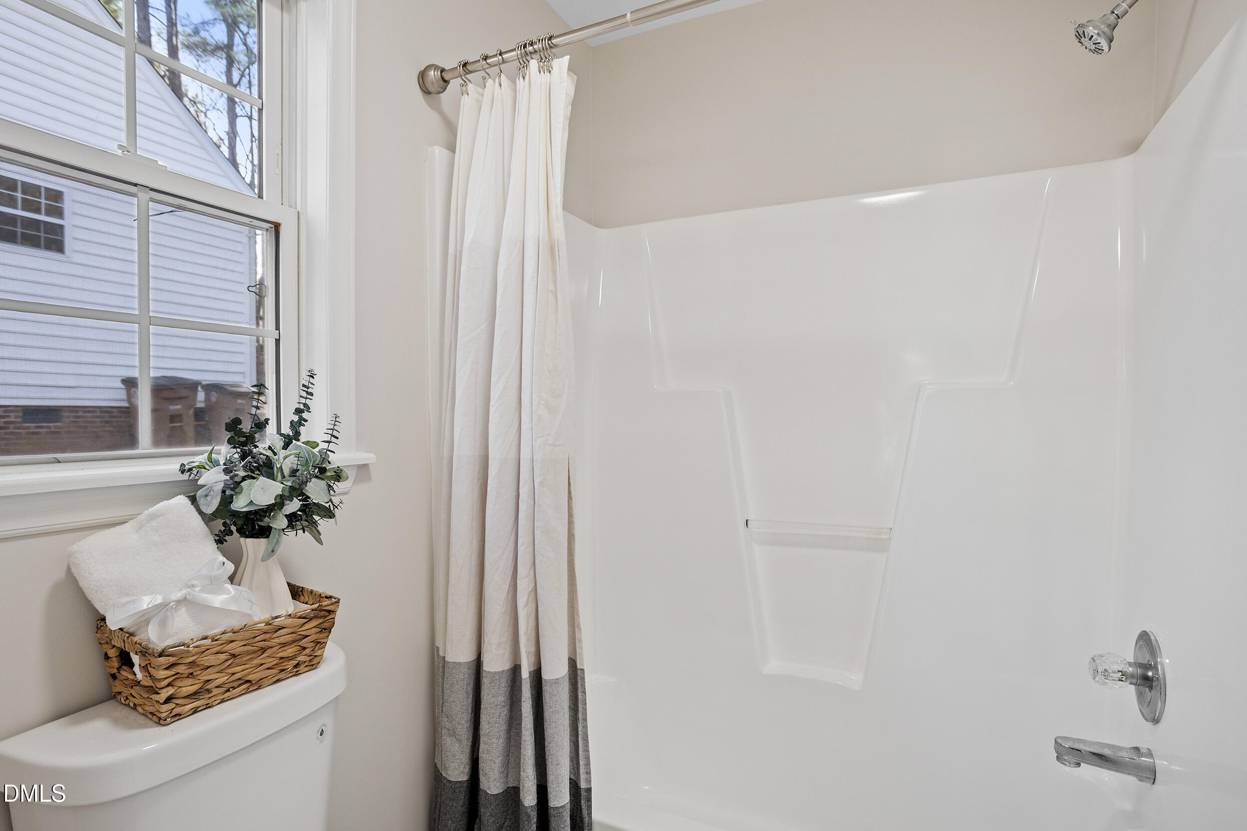 247 Tillamook Drive Wake Forest, NC 27587 - Photo 20 of 30 a bathroom with a shower curtain