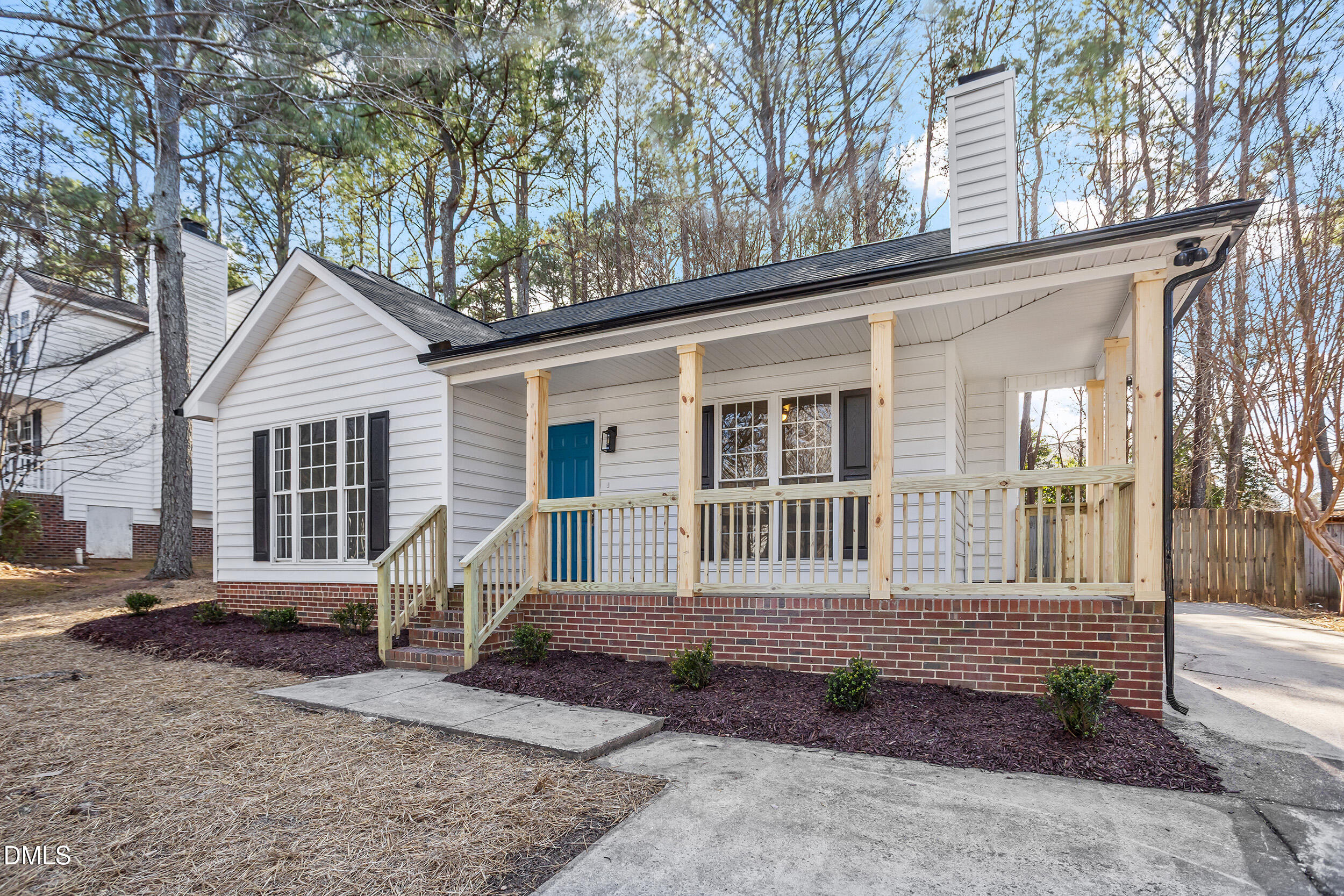 247 Tillamook Drive Wake Forest, NC 27587 - Photo 23 of 30 a front view of a house with garden