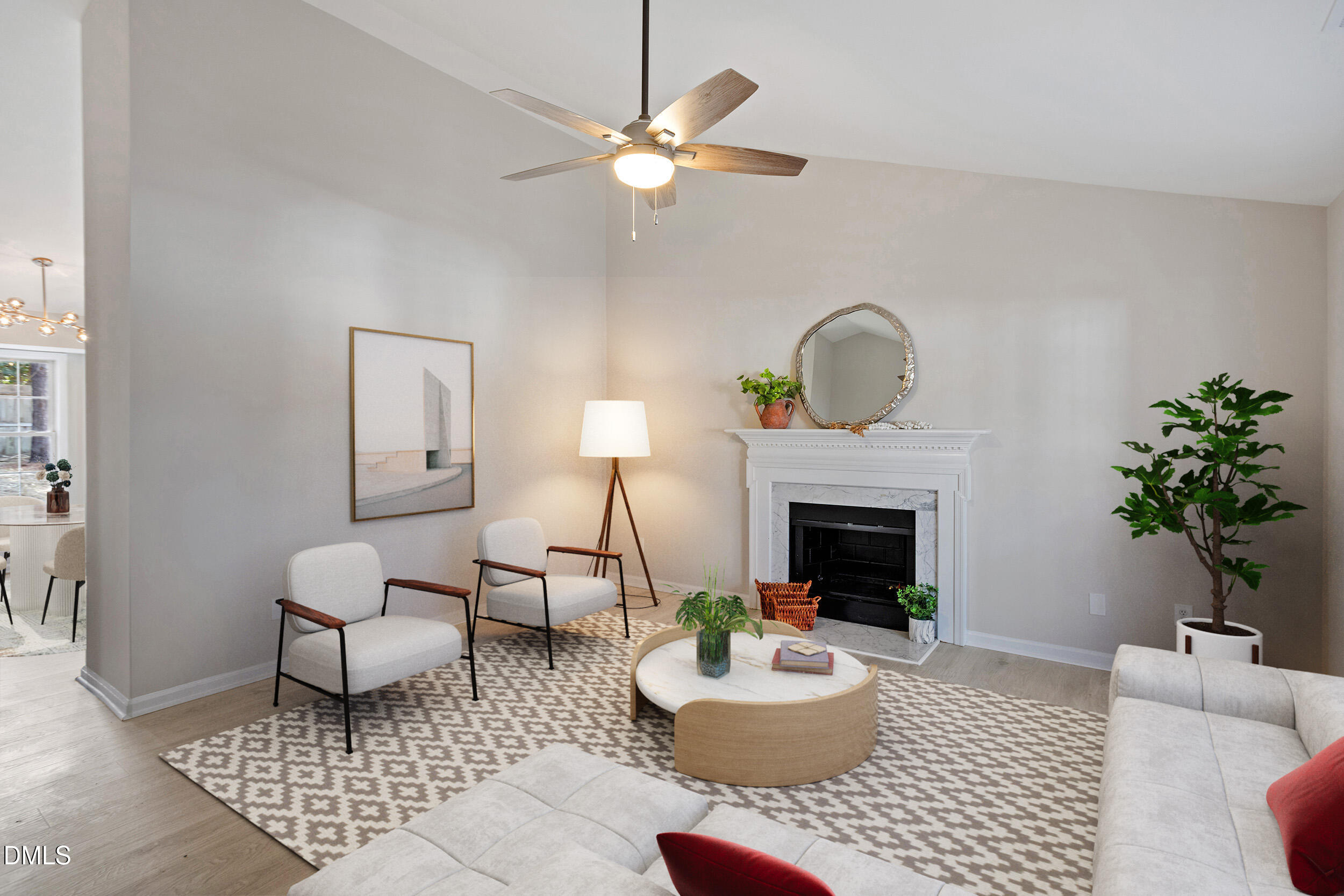 247 Tillamook Drive Wake Forest, NC 27587 - Photo 3 of 30 a living room with furniture a fireplace and a potted plant