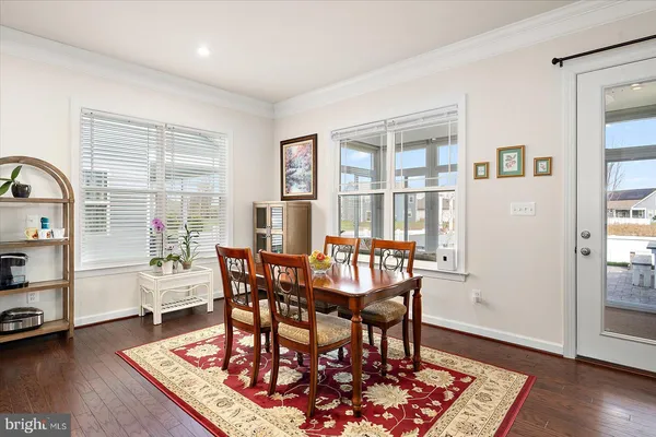 a view of a livingroom with workspace and a couch