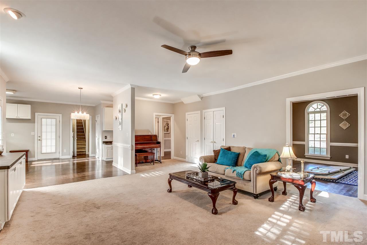 9024 Hemingwood Court Raleigh, NC 27613 - Photo 11 of 28 a living room with furniture and a fireplace