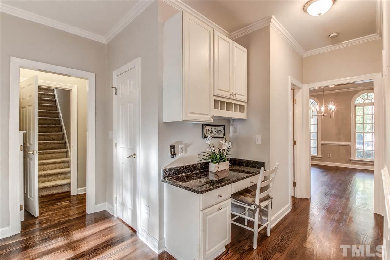 9024 Hemingwood Court Raleigh, NC 27613 - Photo 14 of 28 a kitchen with stainless steel appliances granite countertop a stove and a refrigerator