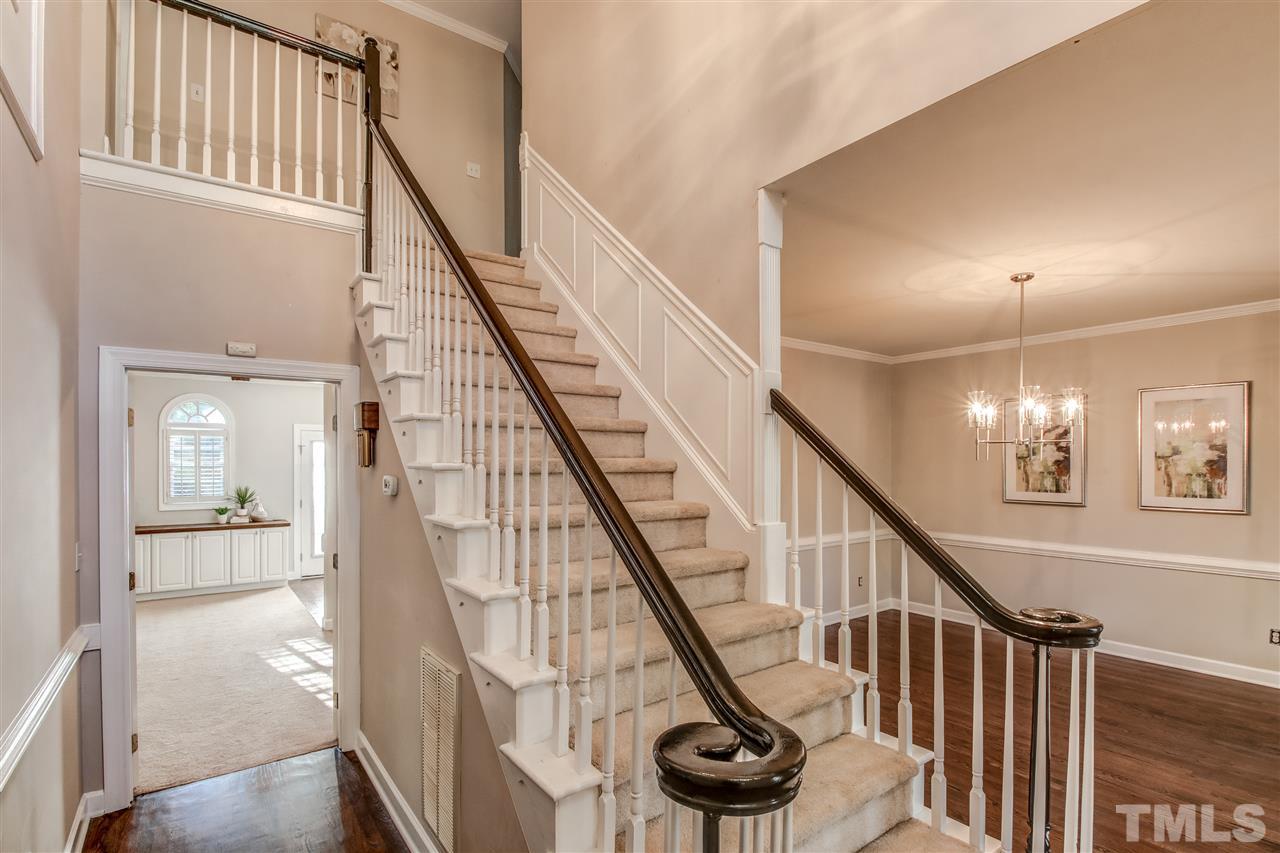 9024 Hemingwood Court Raleigh, NC 27613 - Photo 3 of 28 a view of entryway and hall with wooden floor