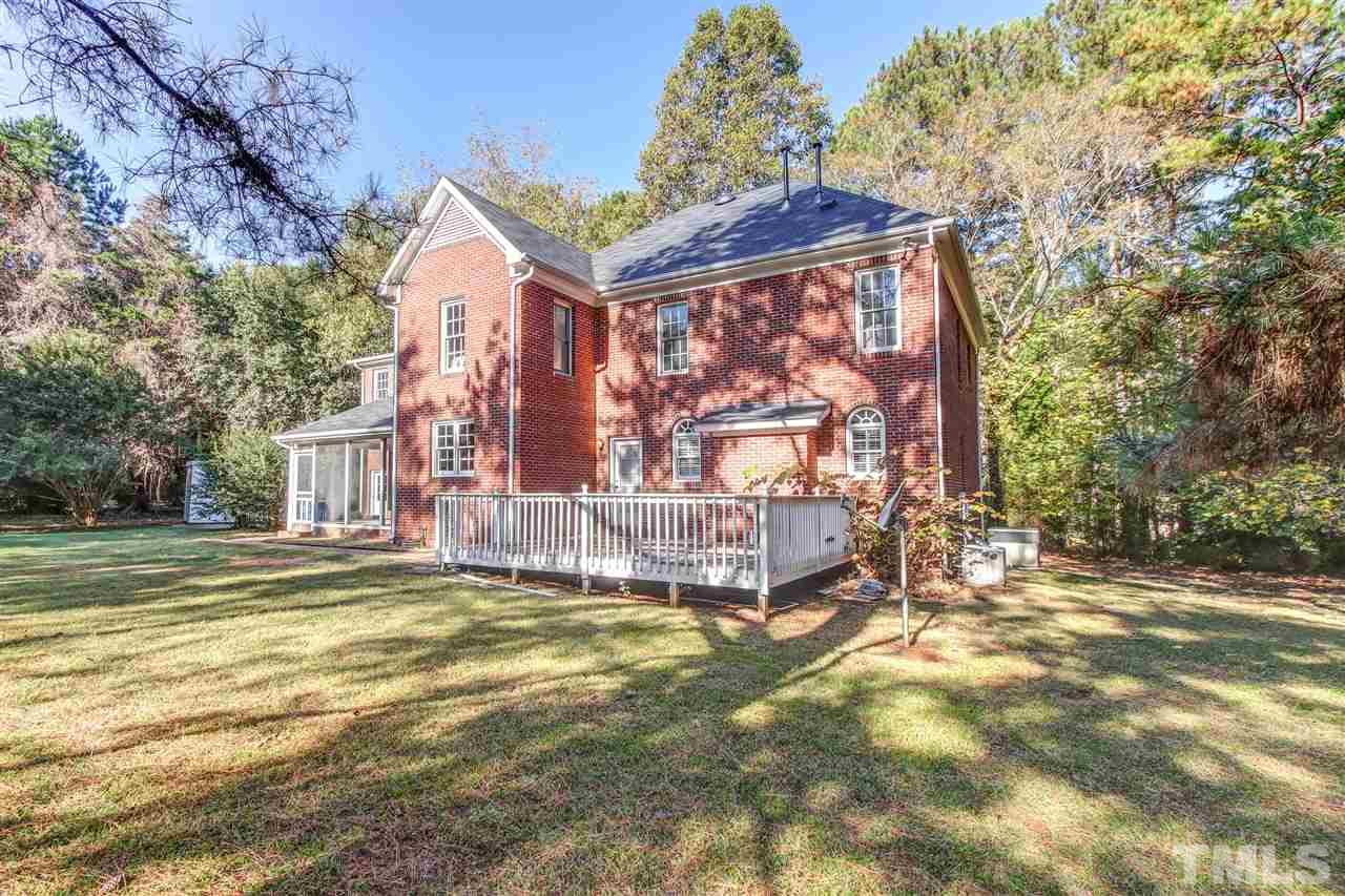 9024 Hemingwood Court Raleigh, NC 27613 - Photo 26 of 28 a view of a house with a big yard and large trees