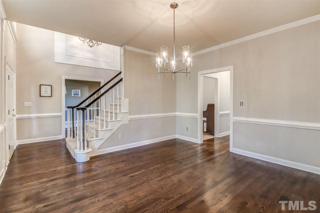 9024 Hemingwood Court Raleigh, NC 27613 - Photo 6 of 28 a view of entryway and hall with wooden floor