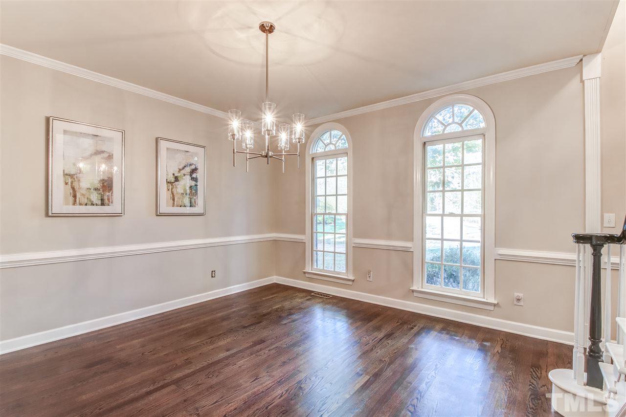9024 Hemingwood Court Raleigh, NC 27613 - Photo 7 of 28 a view of livingroom with window and hardwood floor