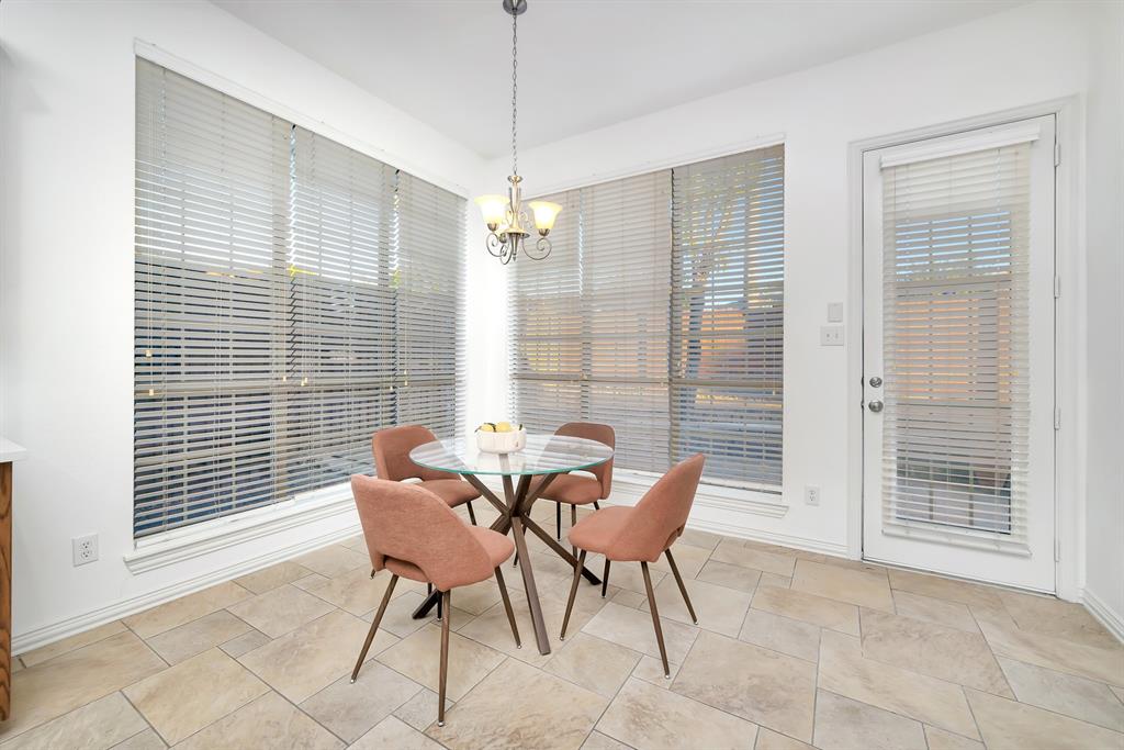 9328 Old Veranda Road Plano, TX 75024 - Photo 17 of 40 a view of a dining room with furniture and windows