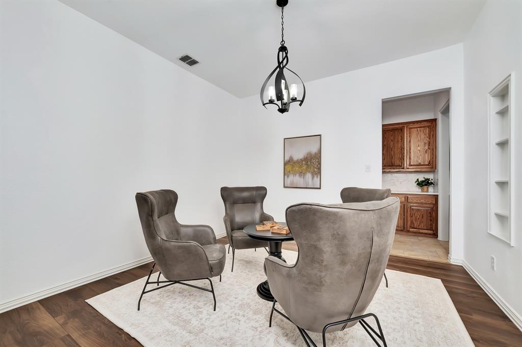 9328 Old Veranda Road Plano, TX 75024 - Photo 19 of 40 a view of a dining room with furniture window and wooden floor