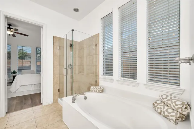 a bathroom with a bathtub and a shower