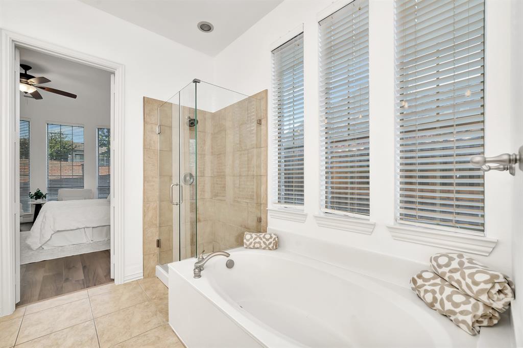 9328 Old Veranda Road Plano, TX 75024 - Photo 25 of 40 a bathroom with a bathtub and a shower