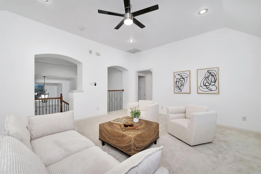 9328 Old Veranda Road Plano, TX 75024 - Photo 30 of 40 a living room with furniture and a wooden floor